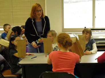 Janice helping students plan their Puppets