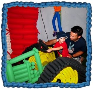 Father and son pose on a Balloon Tractor